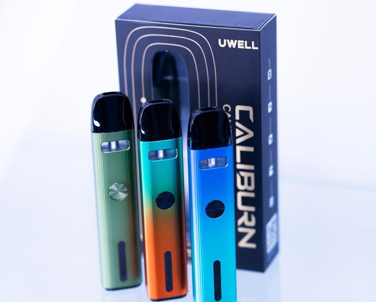 Disposable vape and rechargeable pod device side by side on a counter
