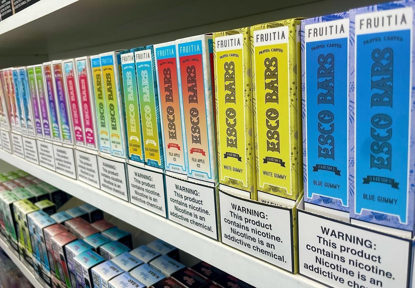 Vape Vibes Salem NH staff comparing e-liquid flavor options